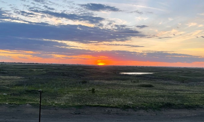 Saskatoon House | Sunset at Prairie Luxury Suite with NE Swale View