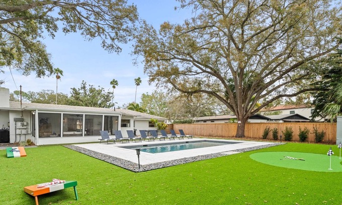 Virginia Park House | Sunset Park Retreat w/Heated Pool, Lanai, Putting Green & Room for 8 – Relax in South Tampa!