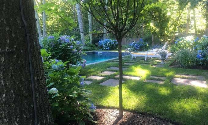 Water Mill House | Swim in a sea of hydrangeas on this peaceful, bucolic property.