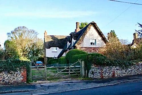 Cheveley House | Thatched Cottage - with dog Poppy