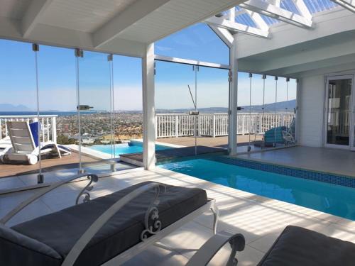 Mountainside House | 'The Bolussi Beachhouse', sleeps 12 in 6 en-suite bedrooms with Indoor Pool