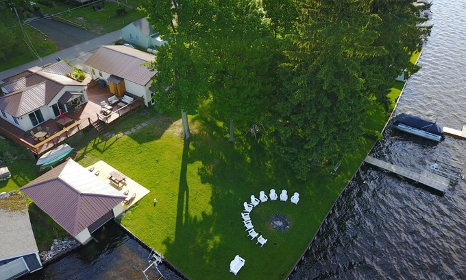 Ludington Cottage | The Bunkalow Lakefront Compound w Lifts for your Speed Boat & Tritoon