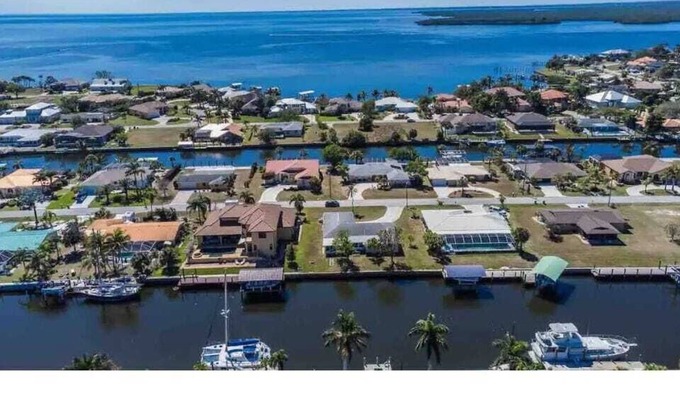 Edgewater House | The Dolphin: Tranquil Waterfront Home- near Beach