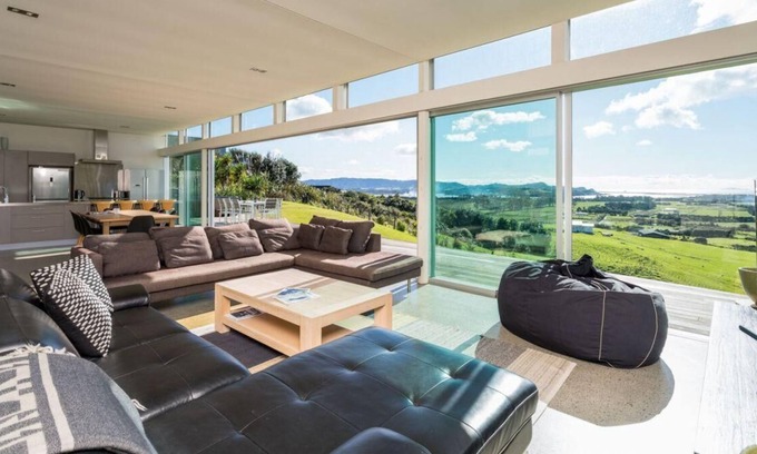 Mangawhai House | The Glass House - Modern, pet-friendly designer holiday home with spectacular views and spa pool