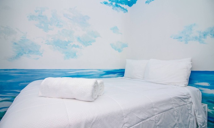 Queens Condo | The High Tide Studio #6 Studio Bedroom Hotel Room by RedAwning