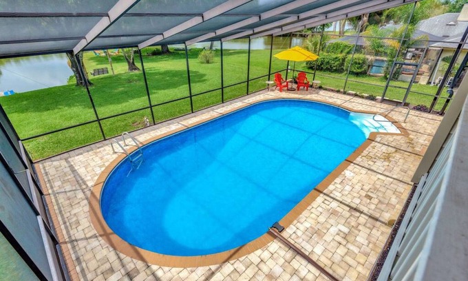 Lakeview Village House | The Oak house. HEATED Pool. Waterfront. Fire pit. Swings