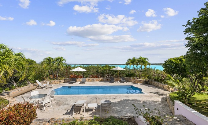 George Town House | The Pink House vacation rental, magnificent pool and view over Elizabeth harbor
