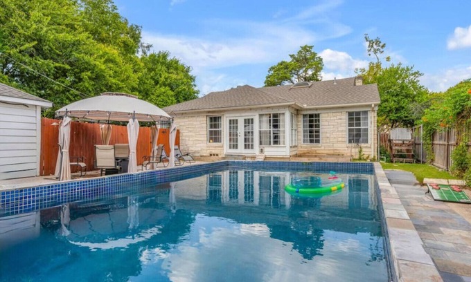 Oak Cliff House | The private home features two master suites with King beds and full attached bathrooms. The loft is 3rd private getaway with a Queen bed and attached full bath. Fully stocked kitchen and a separate Oak dining area.