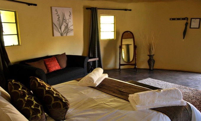 Leribe District House | The Queen-Size-Bed Riverside Huts
