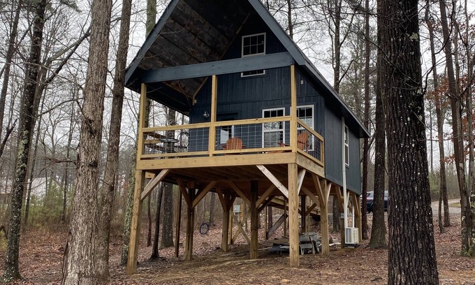 Mentone Cottage | The Treehouses on wooded acreage that overlook a large lake.