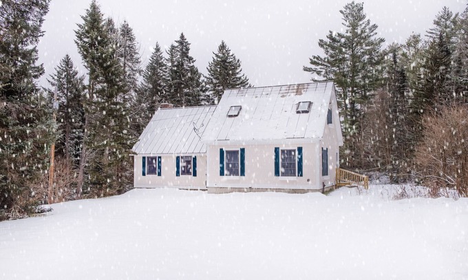 Belmont Ski Chalet | The Whimsical Chalet is a lovely cape on acres. Private setting less than 10 minutes to skiing.