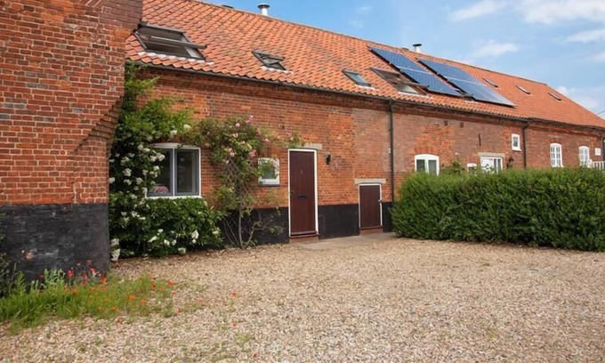 Brancaster Staithe Cottage | This delightful cottage has a fabulous open-plan kitchen/dining area with fitted kitchen. French doo