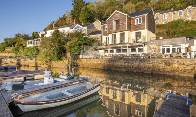 Truro House | This holiday home is situated right on the water’s edge within the Malpas Marina