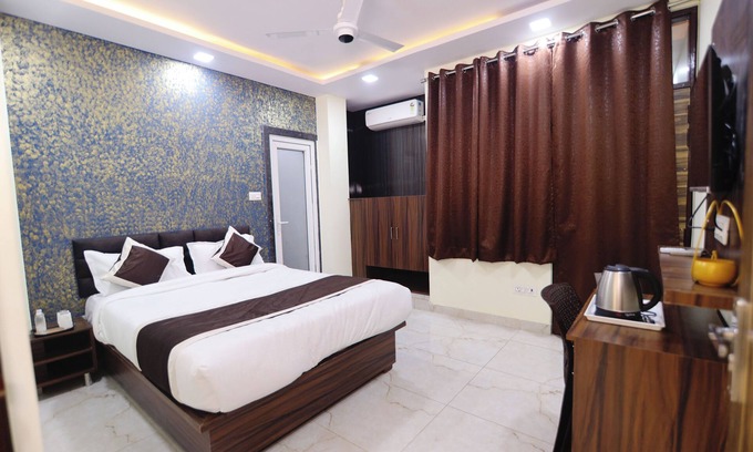 Kalyanpur House | This room features a spacious king-sized bed, designed for maximum comfort