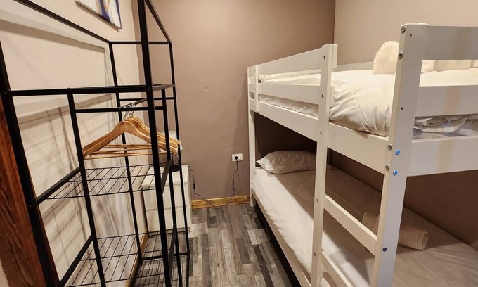 Vilaflor Apartment | This room is a bunk room with two single bunk beds. The bathroom and showers are shared with the two other bunk rooms . The room has a great view of the village square.