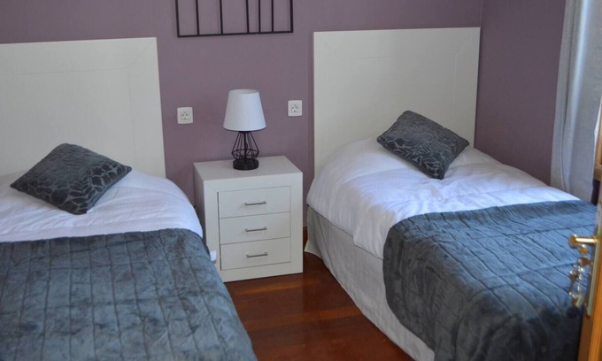 Vilaflor Apartment | This twin room has two single beds with a private separate bathroom (bathroom across the hallway). The view is of the whole garden area and the sea can be seen on clear days.