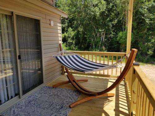 Phenix City Ski Chalet | Tiny home with hammock loft BBQ and yard
