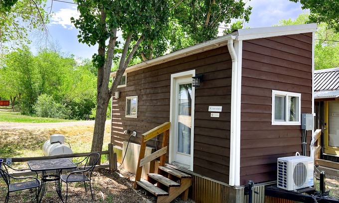 Montrose House | Tiny home with one lofted queen bed and twin sized day bed.