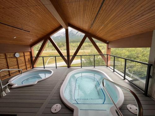 Canmore Apartment | Top FL 2BR 2BA Hot Tubs phenomenal mountain views
