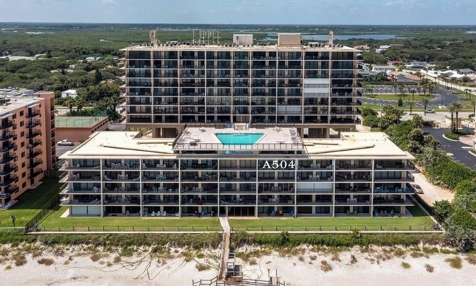 New Smyrna Beach Condo | Top floor beach front suite with 27' balcony & rooftop pool.