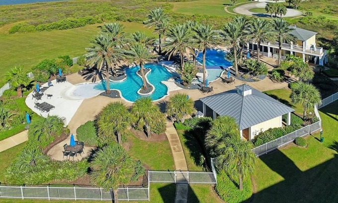 Galveston Condo | Top floor condo looking out at West Bay and the heated Sunset Pool/Lazy River!