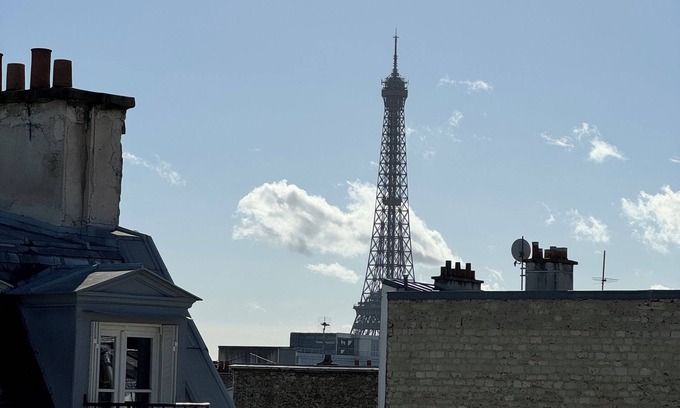 Champs-Elysees Apartment | Top floor Paris studio - view of rooftops and monuments