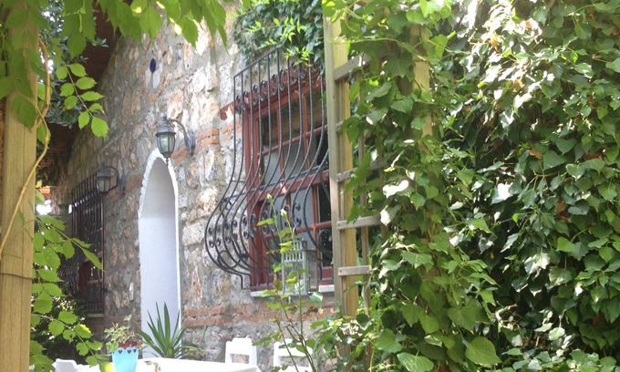 Kayakoy Cottage | Traditional stone cottage with stunning garden in historic Kaya village.