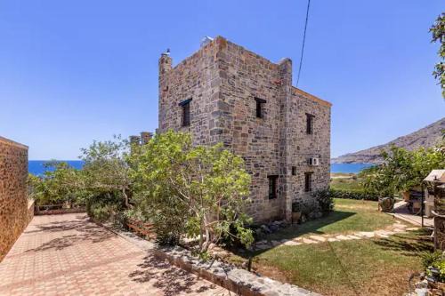 Gortyna House | Traditional stone house by the sea.