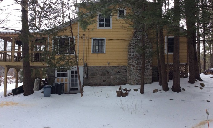 Wells House | Tranquil lakefront home sits above the lake with an unobstructed view