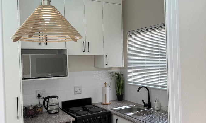 Newcastle Apartment | Tranquil One bedroom poolside apartment