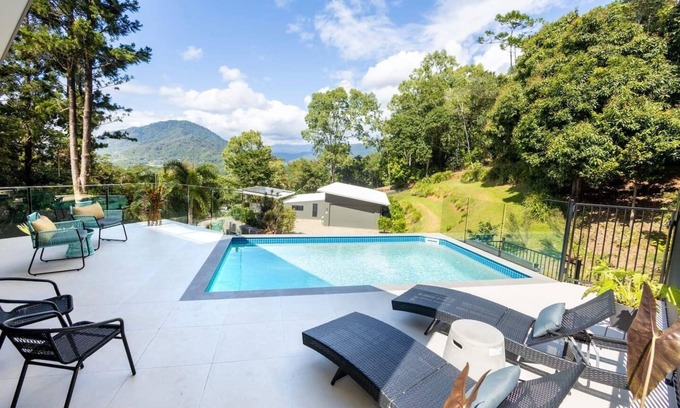Brinsmead House | Treetops Retreat: A Serene Rainforest Escape with Mountain Views