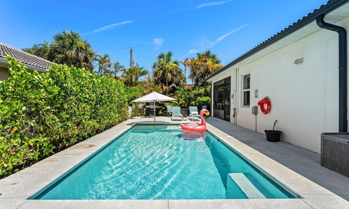Cocoa Beach House | Tropical Backyard Oasis w/Screened in Outdoor Patio, Pool, Gas Firepit & BBQ Grill!