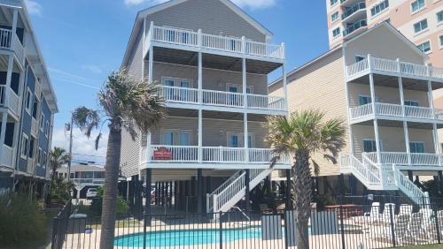 North Myrtle Beach House | Tropical Dunes I - 8 Bedroom Oceanfront Home - Private Pool Game Room and Elevator