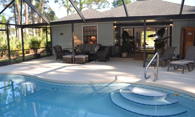 Palm City House | Tropical Paradise! Heated Pool & Sauna. Large very private yard. Near Everything