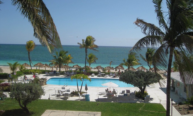 Discovery Bay Condo | Tropical paradise steps away from gorgeous sandy beach & beautiful blue water