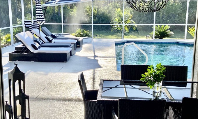 White Marsh House | Tropical Retreat - Oversized heated pool, golf, pickle-ball, tennis, bikes,