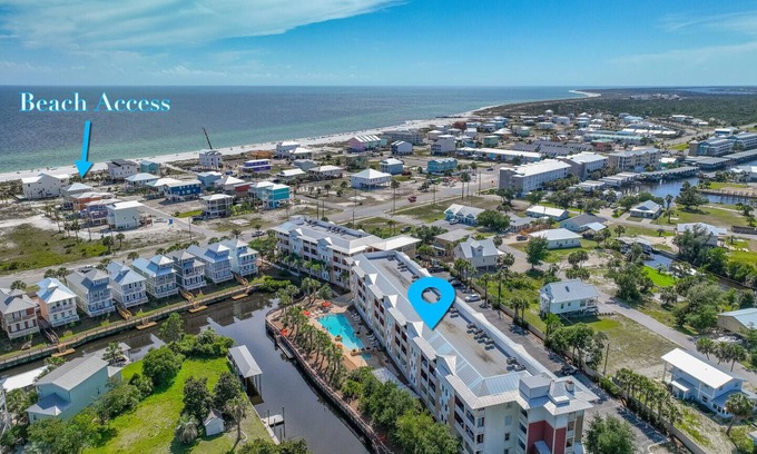 Waterside Village Condo | Tropical Retreat with Canal Views, Beach Service, Pool, Hot Tub
