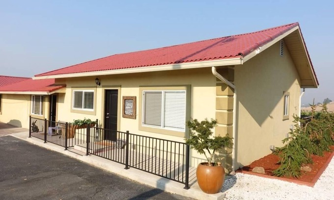 Talent Apartment | Two cottages with king bed bedrooms, dining area and full kitchen.