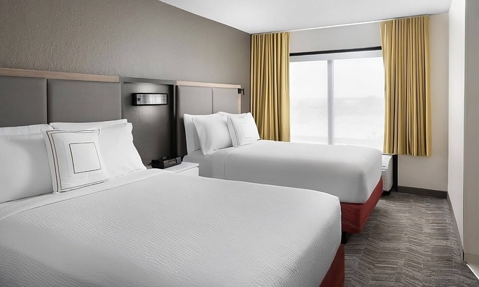 Southeast Houston Hotel | Two Family Ready Rooms w/Living Area, Pool, and Daily Free Breakfast