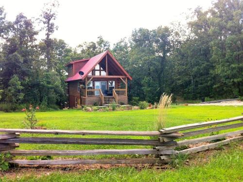 Steelville House | Two-Story Log Cabin Rental with a Hot Tub near Upper Meramec River, Missouri