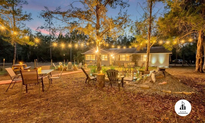 Eustis House | Uhost AI | 4BR Getaway |Cozy Firepit & Hot Tub Fun