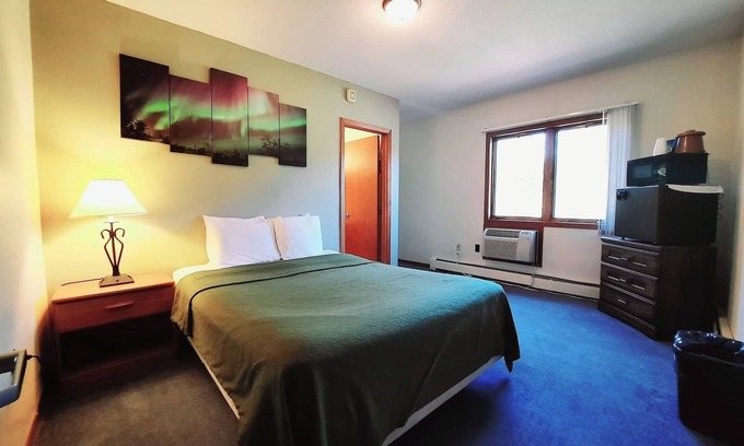 Ironwood Apartment | Unique Northern Lights Themed Guestroom inside the Lodge at North Ironwood Acres for up to Four people. 2 Queens, 2 Bathrooms. Dog Friendly resort!
