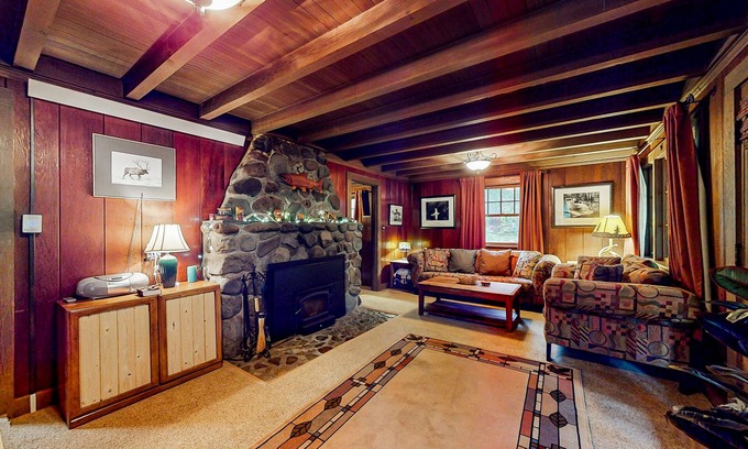 Marmot Apartment | Unwind in nature's embrace at a 1925 cabin with hot tub & river views