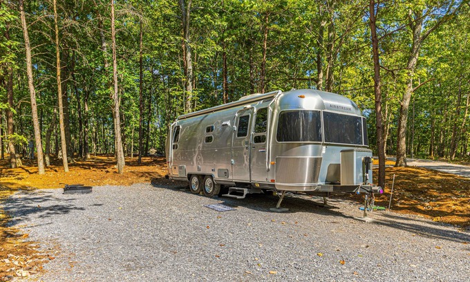 Menlo House | Updated Airstream tucked into trees with firepit, full bathroom & kitchenette