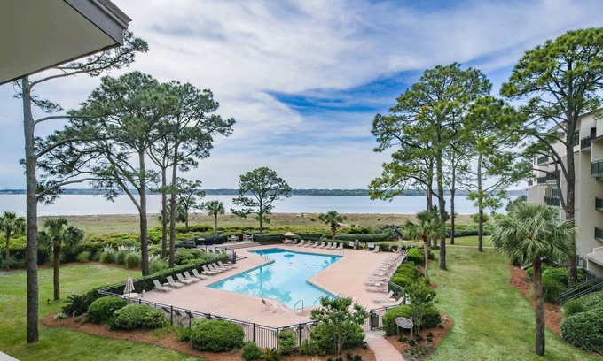 South Beach Condo | Updated & Gorgeous End Unit with Spectacular Views of Pool & Sound. South Beach Oasis Awaits you!