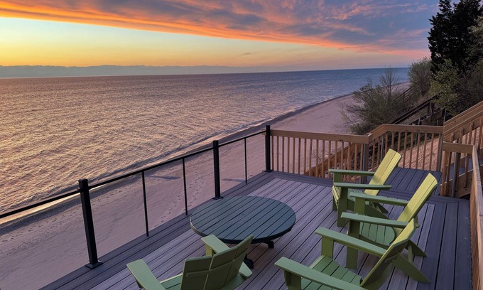 Fennville House | Updated lakefront oasis with private beach, fire pit, amazing views & waterside balcony!