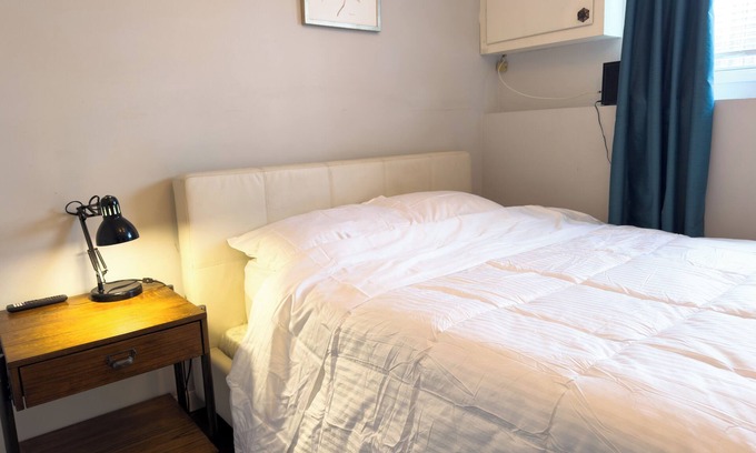 Sunnyside House | Urban Escape: Private Room in Bi-level lower level