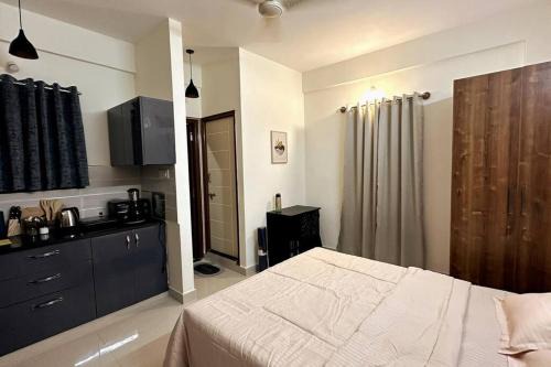 Electronics City Apartment | UrbanPod 1RK with Balcony Electronic City