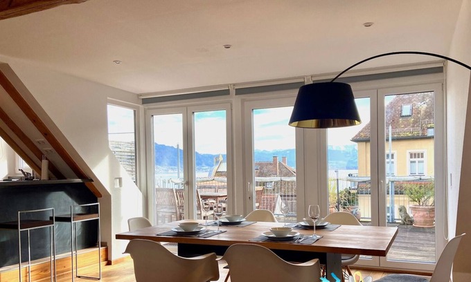 Insel Apartment | Vacation apartment with lake view - maisonette with roof terrace in the old town house on the island