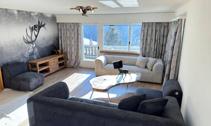 Engadin Scoul House | Vacation home with wellness area in alpine chic retro style